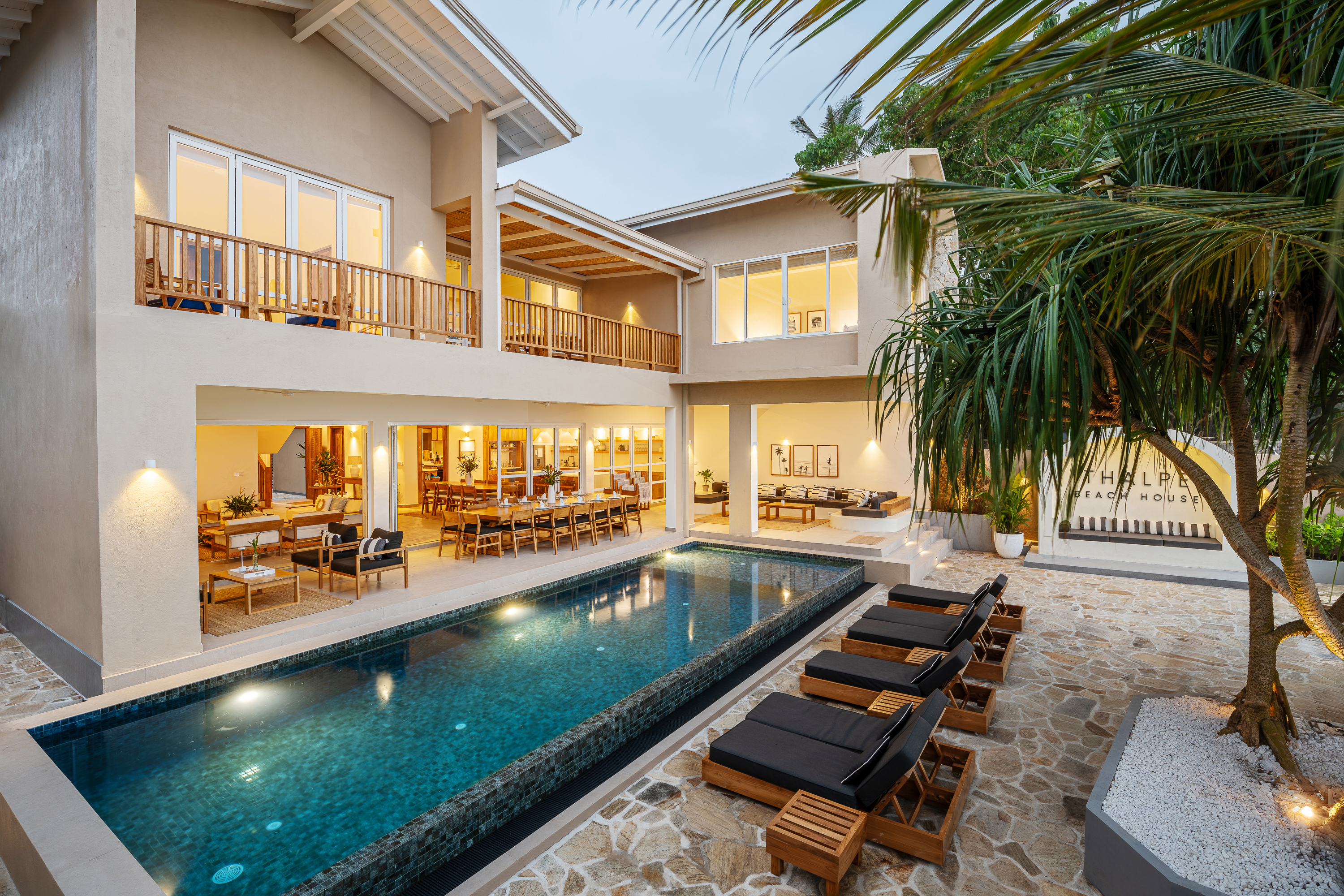Thalpe Beach House - beachfront exterior at dusk with private pool