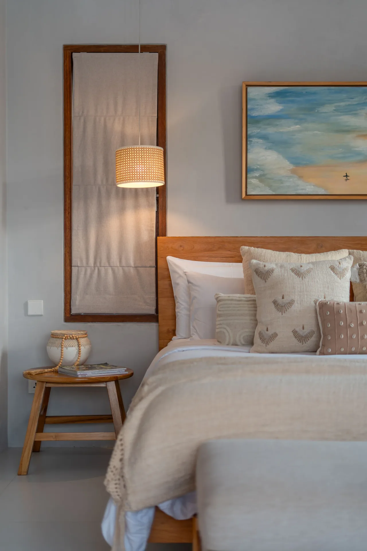 Master bedroom with ocean artwork and desk area