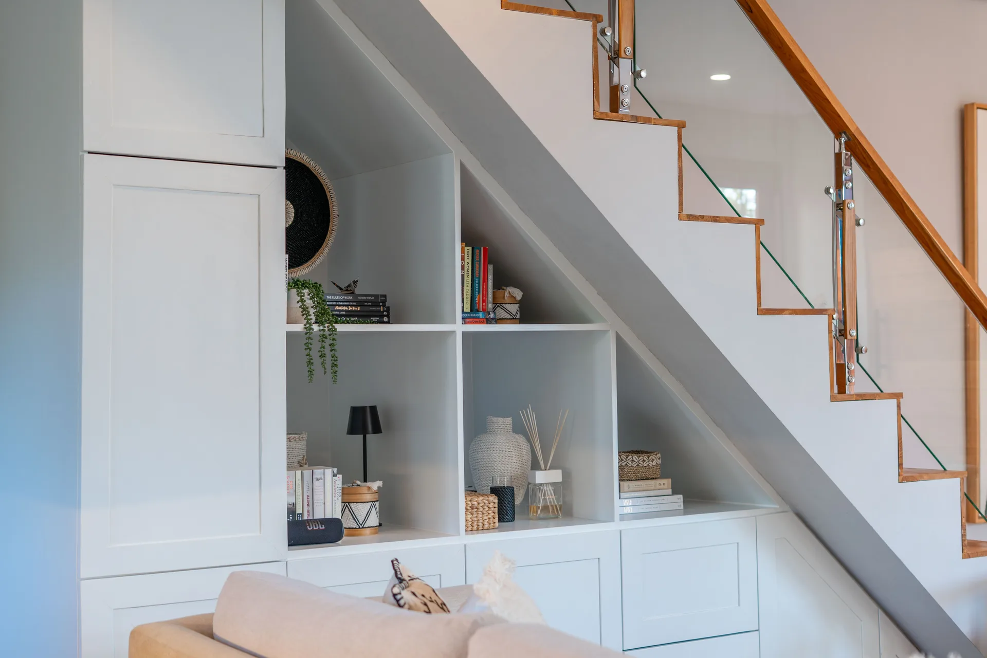 Wall shelves with curated books and decorative accessories